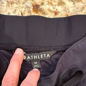 Athleta women’s  Black Drawstring  26 inch inseam size 10 back zipper pockets